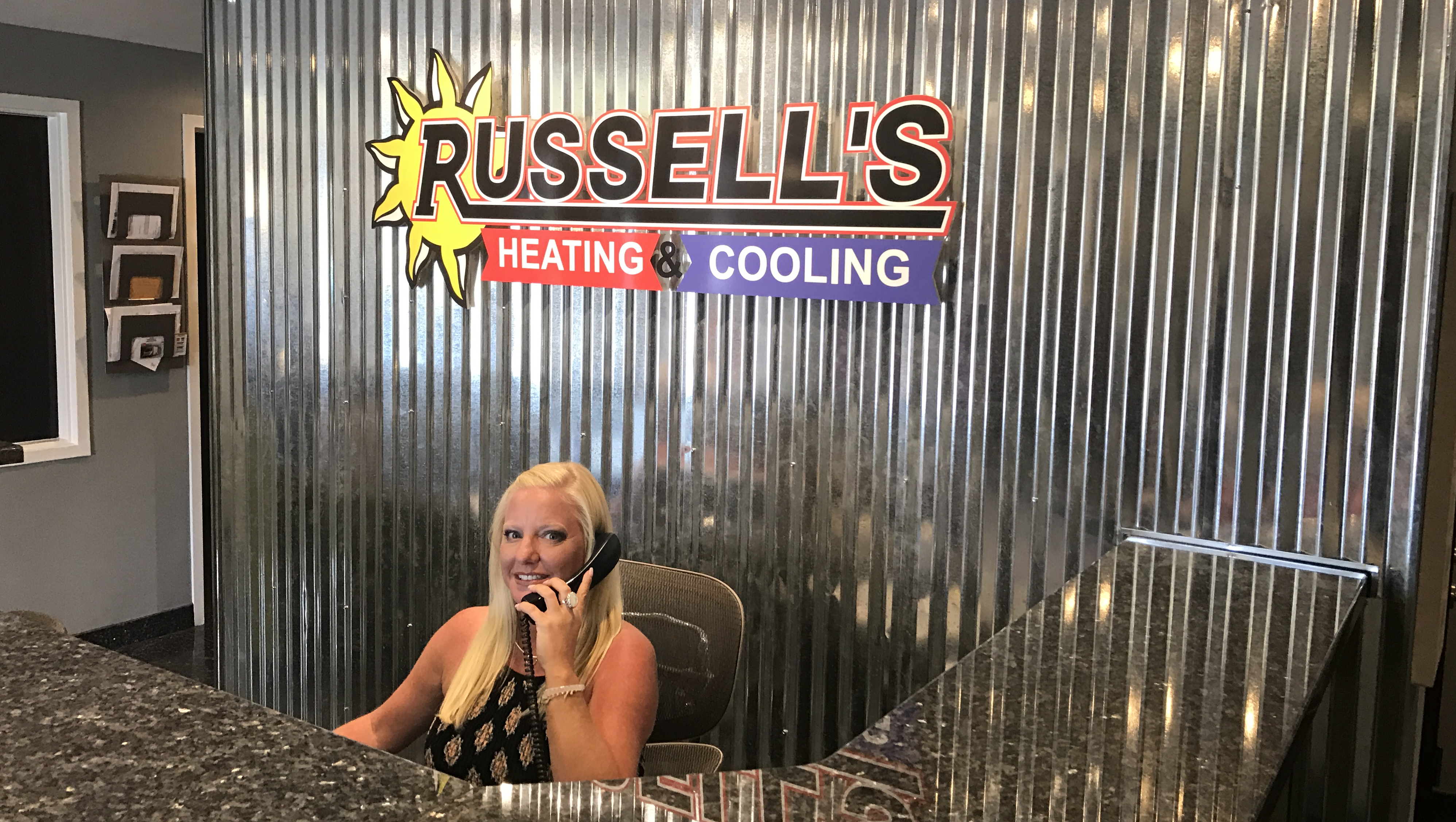 Staff member at Russell's HVAC answering phone