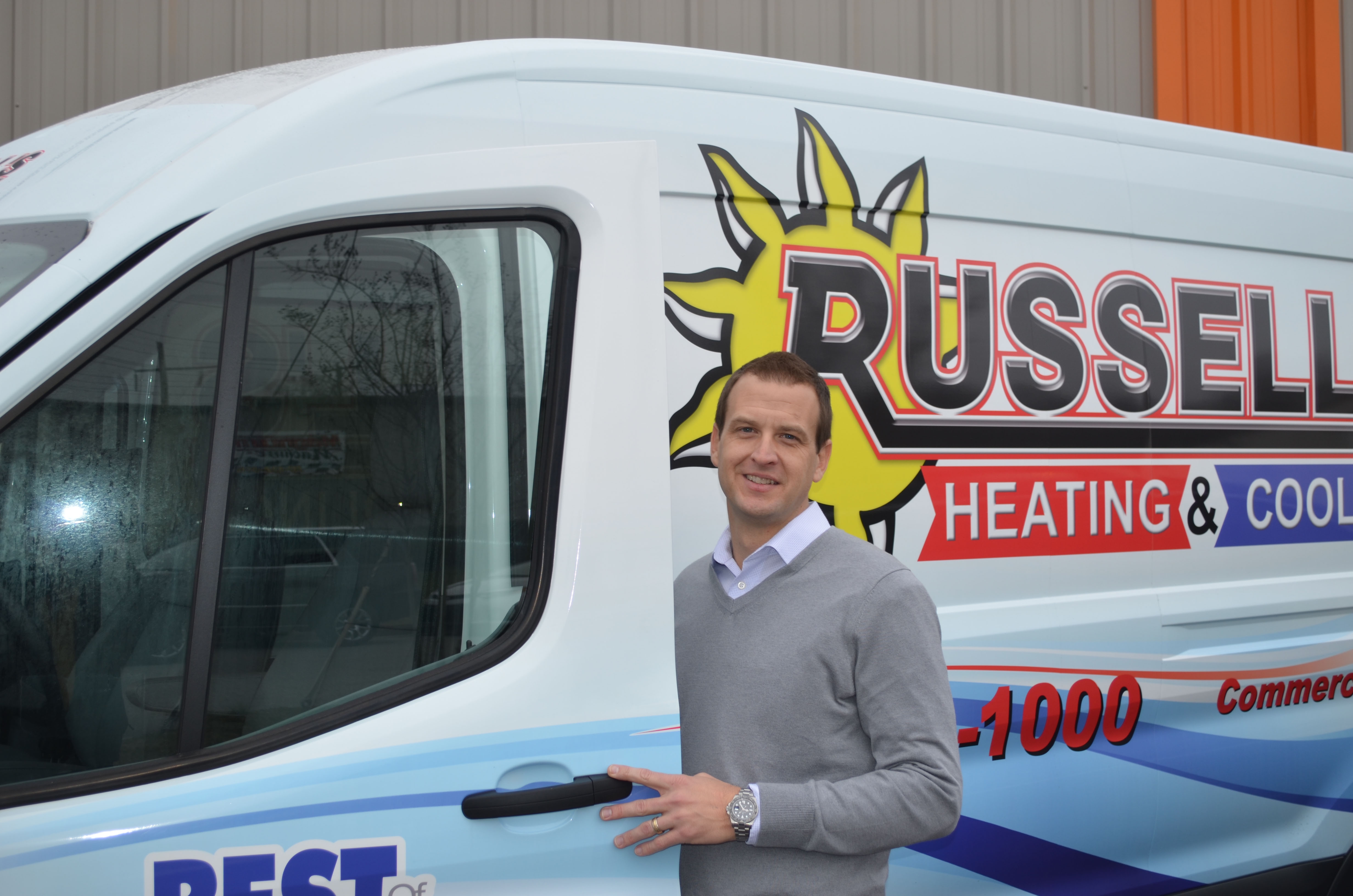 Russell's employee opening door to Russell's van