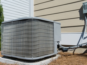 Outdoor air condenser unit outside residential home