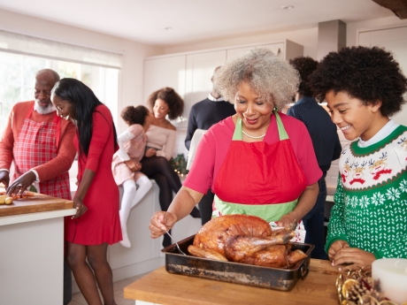 family gathered in kitchen before Christmas dinner