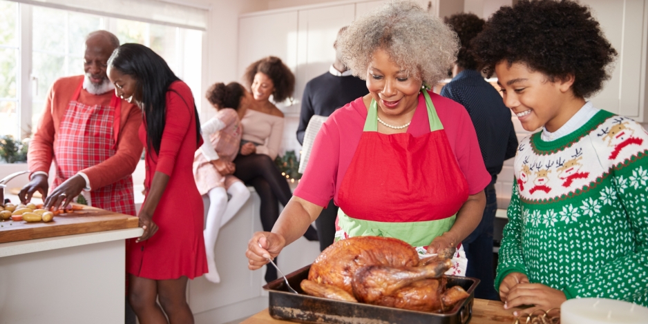 family gathered in kitchen before Christmas dinner